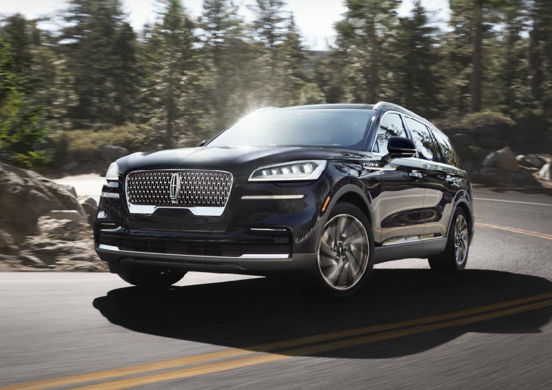 A Lincoln Aviator® SUV is being driven on a winding mountain road | Dorsch Lincoln in Green Bay WI