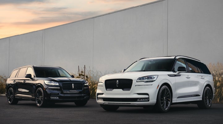 Two Lincoln Aviator® SUVs are shown with the available Jet Appearance Package | Dorsch Lincoln in Green Bay WI