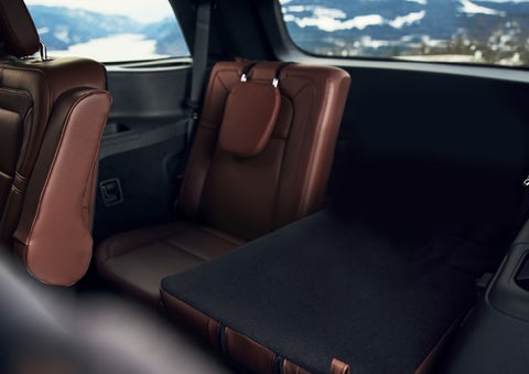The left rear seat of a 2024 Lincoln Aviator® SUV is shown folded flat for additional cargo space | Dorsch Lincoln in Green Bay WI