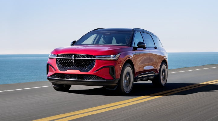 A 2024 Lincoln Nautilus® SUV is being driven on a seaside roadway. | Dorsch Lincoln in Green Bay WI