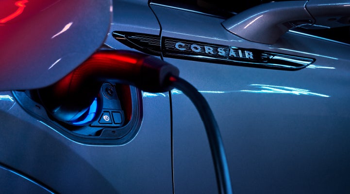 A charger plugged into the charging port of a 2024 Lincoln Corsair® Plug-in Hybrid model. | Dorsch Lincoln in Green Bay WI