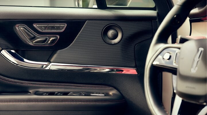 A Revel® audio speaker is shown in the driver's side door of a 2025 Lincoln Corsair® SUV. | Dorsch Lincoln in Green Bay WI