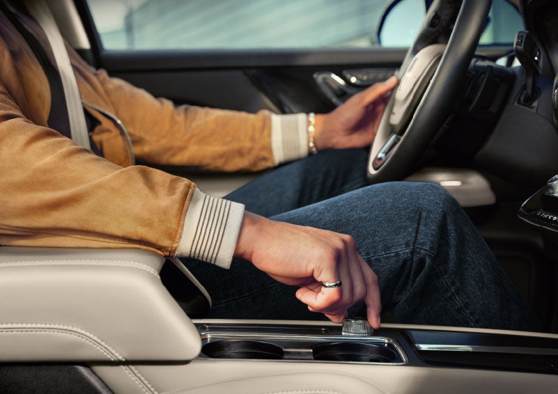 The driver of a 2024 Lincoln Corsair® SUV is shown selecting the drive mode. | Dorsch Lincoln in Green Bay WI