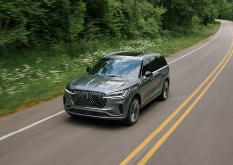 A 2027 Lincoln Aviator® SUV is being driven down a road. | Dorsch Lincoln in Green Bay WI