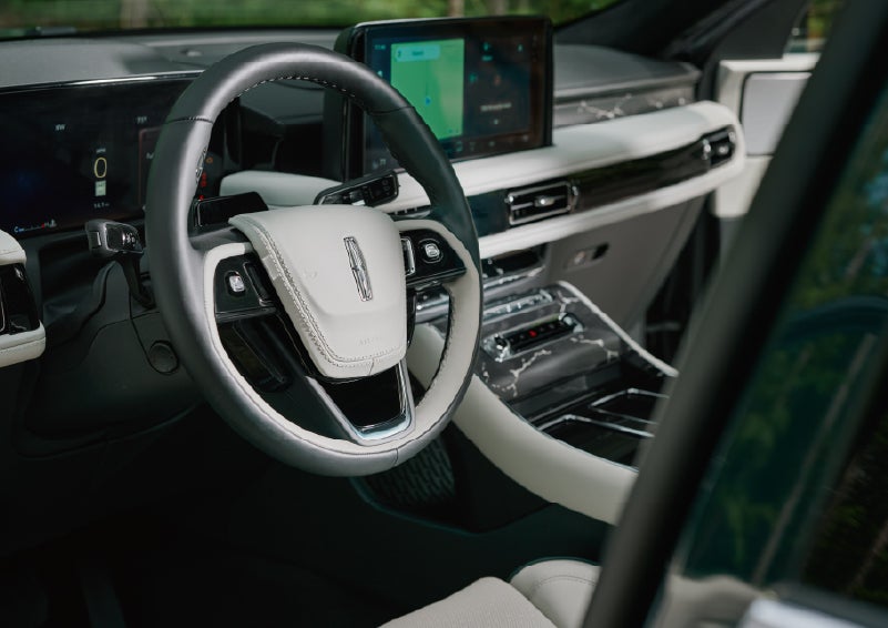 The leather-trimmed steering wheel of a 2027 Lincoln Aviator® Black Label™ SUV. | Dorsch Lincoln in Green Bay WI