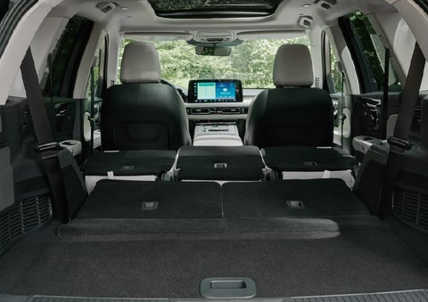 A rear to front view of the interior of a 2027 Lincoln Aviator® Black Label™ SUV shows the third and second rows folded flat | Dorsch Lincoln in Green Bay WI