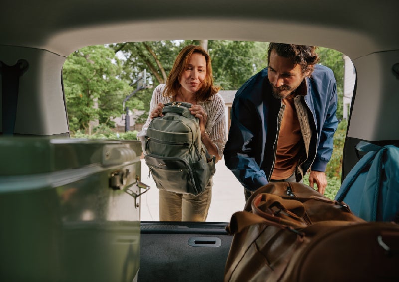 A couple loads luggage into the rear of a 2027 Lincoln Aviator® Black Label™ SUV..e 202 | Dorsch Lincoln in Green Bay WI